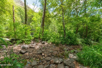 Set beneath the canopy of mature pines and just steps from the - photo 33