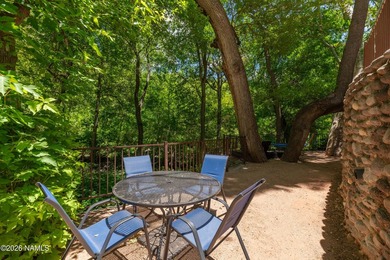 Set beneath the canopy of mature pines and just steps from the - photo 36