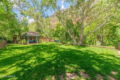 Set beneath the canopy of mature pines and just steps from the - photo 39