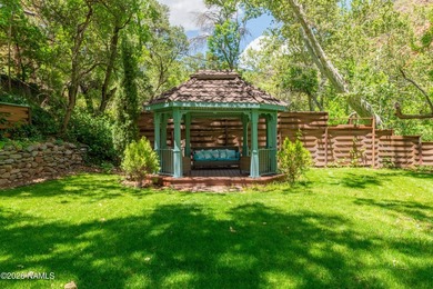 Set beneath the canopy of mature pines and just steps from the - photo 40