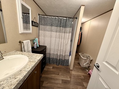 This charming home sits on 1 acre of unrestricted land, offering