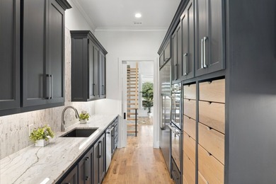 Reintroducing this 2021 custom built home with a newly - photo 14