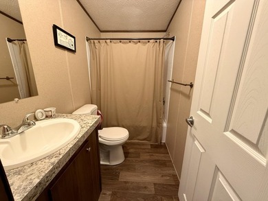 This charming home sits on 1 acre of unrestricted land, offering