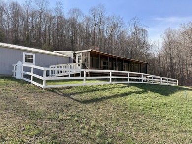 This charming home sits on 1 acre of unrestricted land, offering