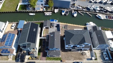Rare South Bellmore Waterfront Opportunity! This meticulously - photo 24