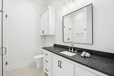 Reintroducing this 2021 custom built home with a newly - photo 28