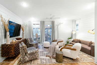 Beautifully upgraded end-unit townhome built in 2023, this Inlet