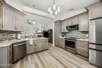 Beautifully remodeled in Hunters Green, this extensive - photo 7