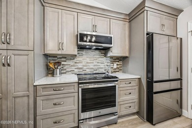 Beautifully remodeled in Hunters Green, this extensive - photo 8
