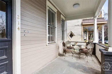 Located at 214 W Park Ave, this impressive circa-1900 property - photo 4