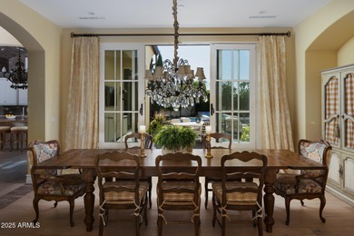 Discover timeless elegance in this 4,626 sq ft French-inspired