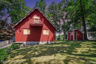 Escape to the peaceful living beauty of lake living in this - photo 2