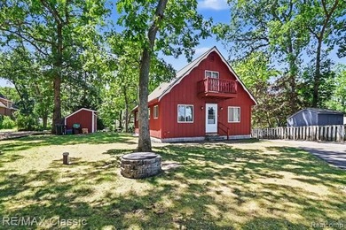 Escape to the peaceful living beauty of lake living in this - photo 3