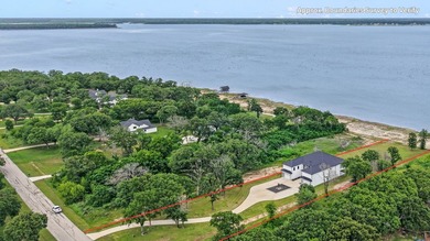 Positioned on 1.5 acres in a gated waterfront community designed - photo 1