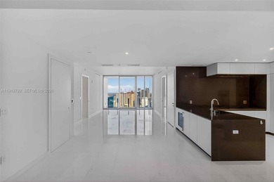 Experience refined waterfront living at Aston Martin Residences