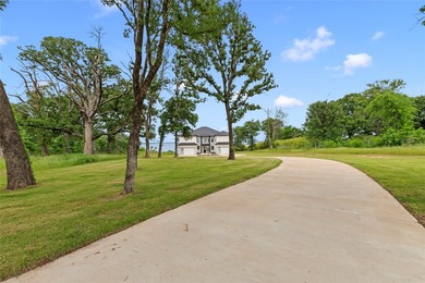 Positioned on 1.5 acres in a gated waterfront community designed - photo 2