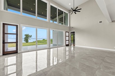 Positioned on 1.5 acres in a gated waterfront community designed - photo 4