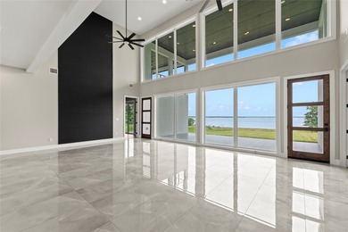 Positioned on 1.5 acres in a gated waterfront community designed - photo 5
