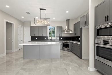 Positioned on 1.5 acres in a gated waterfront community designed - photo 7
