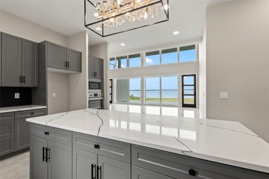 Positioned on 1.5 acres in a gated waterfront community designed - photo 8