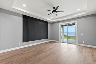 Positioned on 1.5 acres in a gated waterfront community designed - photo 10