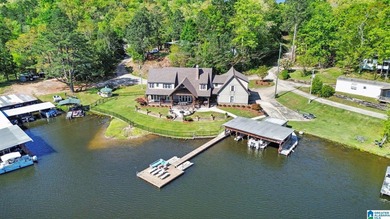 Prestigious Lake Mitchell HOME! Stunning water views from the - photo 3