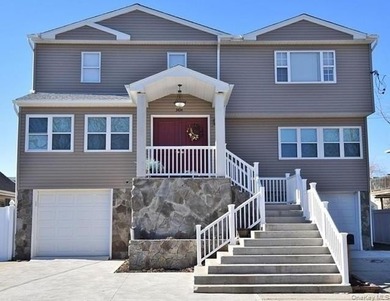 Contemporary three-level, waterfront home. Concrete basement has - photo 1