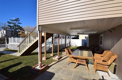 Contemporary three-level, waterfront home. Concrete basement has - photo 3