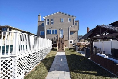 Contemporary three-level, waterfront home. Concrete basement has - photo 6