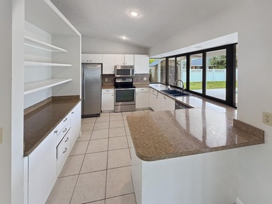 2305 SW Fern Cir is a one-story Port Saint Lucie home with a - photo 2