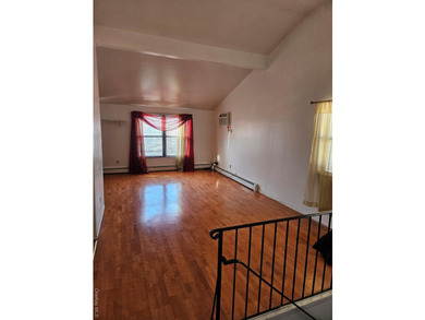 Nicely maintained 2 family home with wood floors. 1st floor has - photo 3