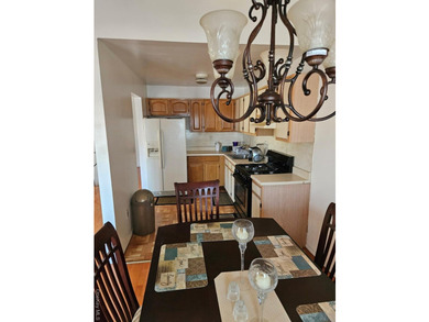 Nicely maintained 2 family home with wood floors. 1st floor has - photo 6