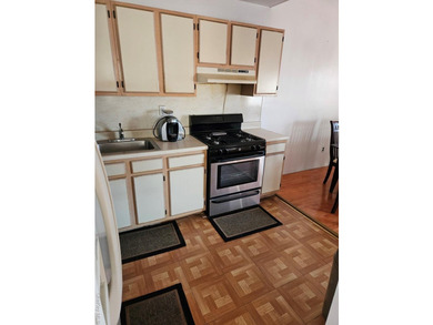 Nicely maintained 2 family home with wood floors. 1st floor has - photo 7