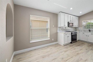 Virtually Staged. Beautifully remodeled golf course home in the - photo 3