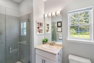 Tucked just off the main corridor in East Hampton, this private - photo 17