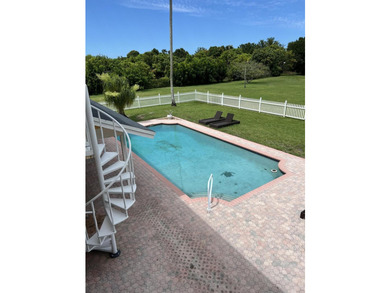 Is there a 4-bedroom home in Palm Beach County with acreage - photo 25