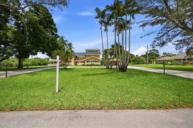 Is there a 4-bedroom home in Palm Beach County with acreage - photo 29