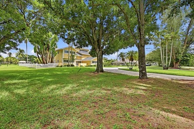Is there a 4-bedroom home in Palm Beach County with acreage - photo 30