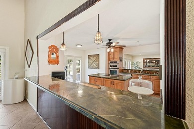 Is there a 4-bedroom home in Palm Beach County with acreage - photo 38