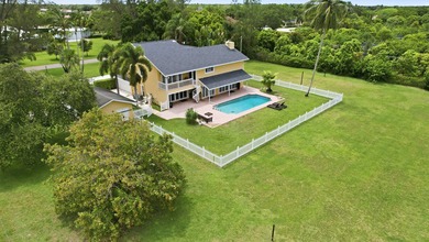Is there a 4-bedroom home in Palm Beach County with acreage - photo 47