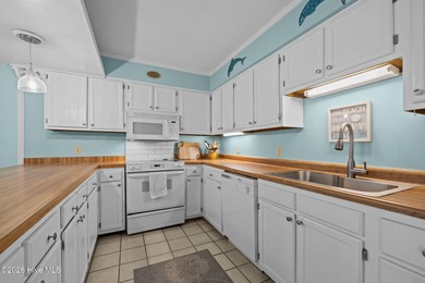 Experience the best of both worlds with this soundside condo