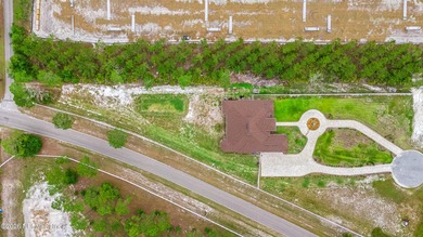 Built in 2023, this exceptional all-brick estate is tucked - photo 3