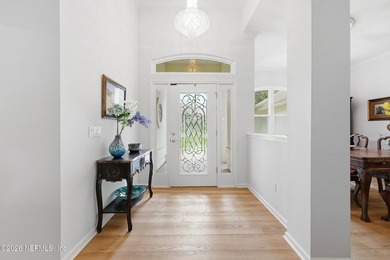Located in the beautiful, gated waterfront and golf community of - photo 3