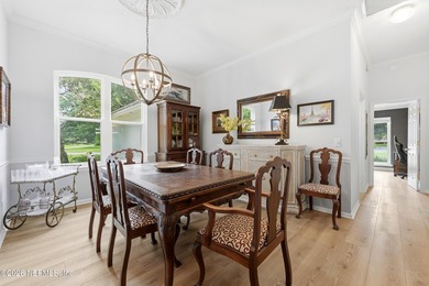 Located in the beautiful, gated waterfront and golf community of - photo 5
