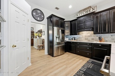 Located in the beautiful, gated waterfront and golf community of - photo 8