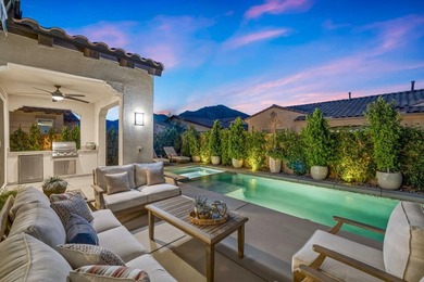 Nestled behind the gates of Floresta, this home stands as one of - photo 2