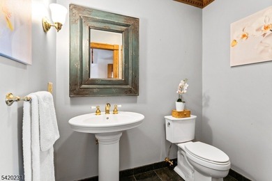 This stately, European-style brick home with striking - photo 17