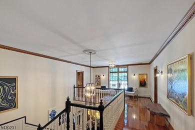 This stately, European-style brick home with striking - photo 18