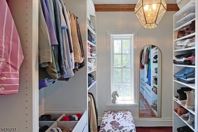 This stately, European-style brick home with striking - photo 22