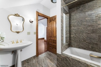 This stately, European-style brick home with striking - photo 29